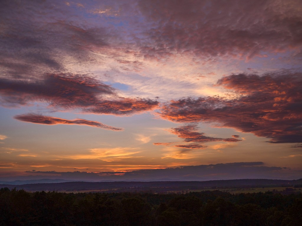 Purple orange sunset with pinkish clouds